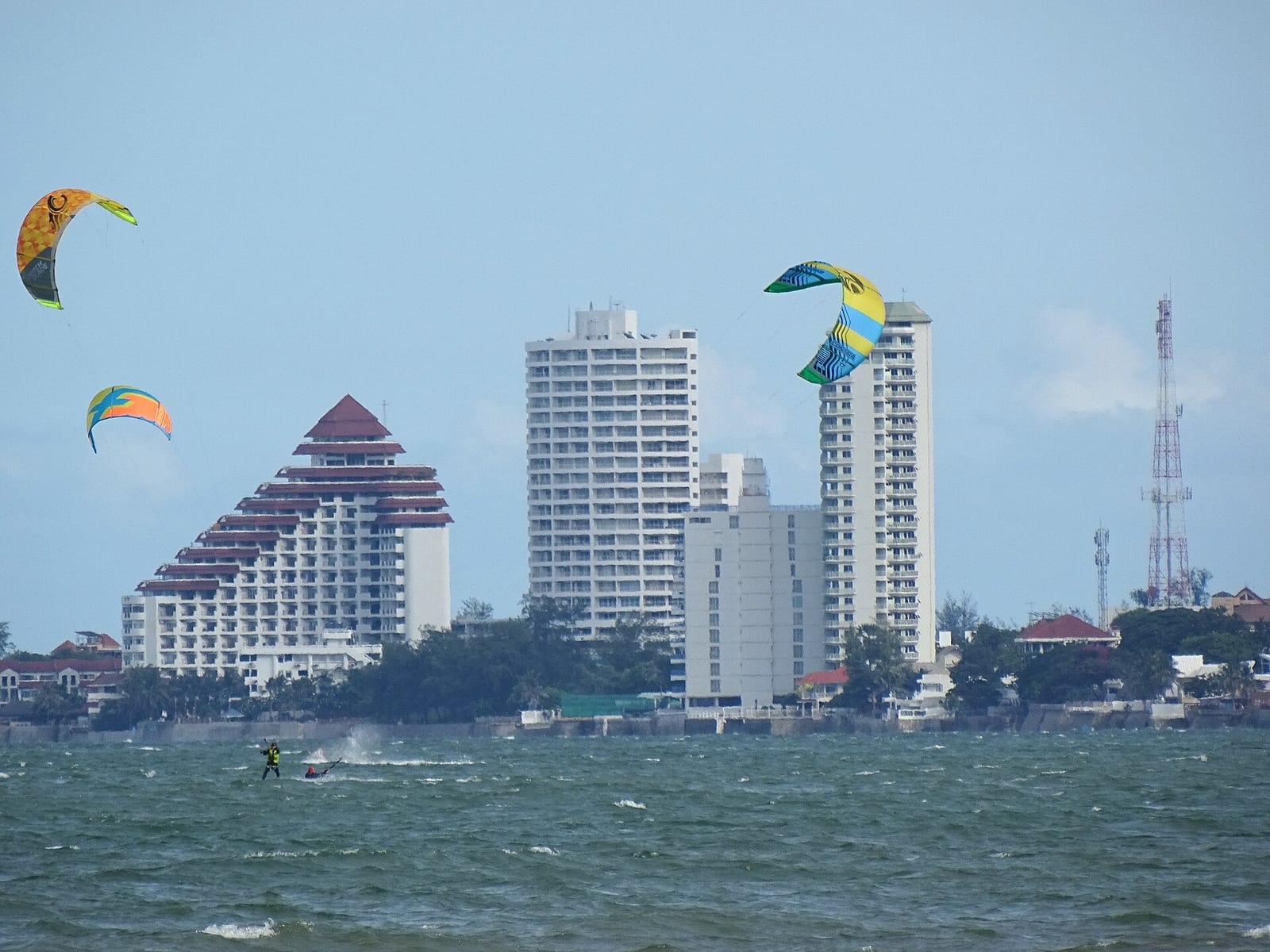 Kitesurfers riding the wind off Hua Hin beach