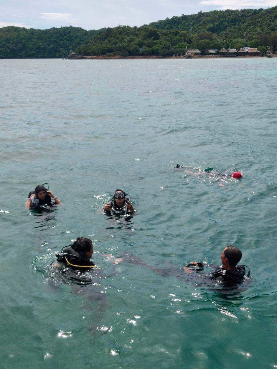 Divers surfacing after a dive