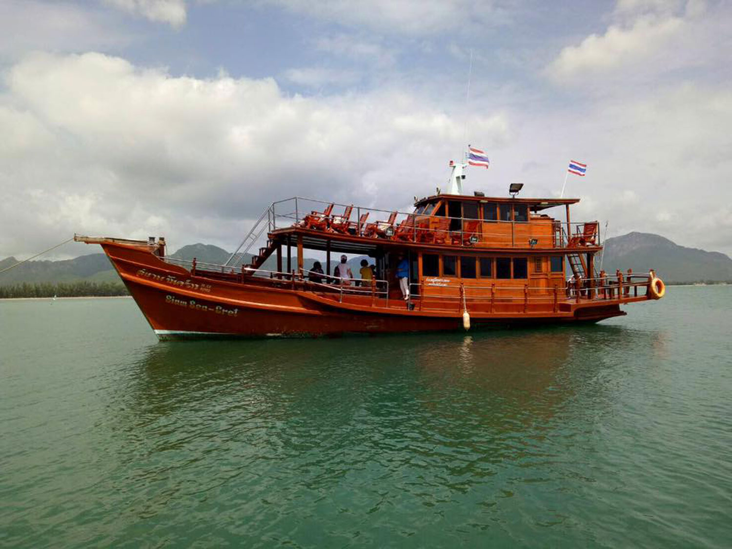 The Siam Sea-Cret — a traditional wooden Thai boat on the Gulf of Thailand